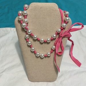 Hot pink silk ribbon and oversized faux pearl long strand necklace.